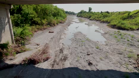 Aerial flight over the Sulphur River in Ladonia, Texas. Camera is heading approximately east and flies below the 904 bridge