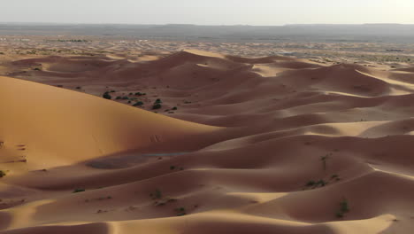 Drone-POV-of-sand-dunes-in-Merzouga-desert,-Morocco