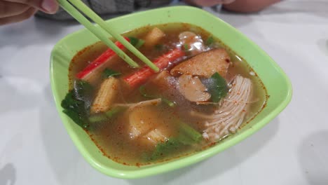 hot pot soup with chopsticks