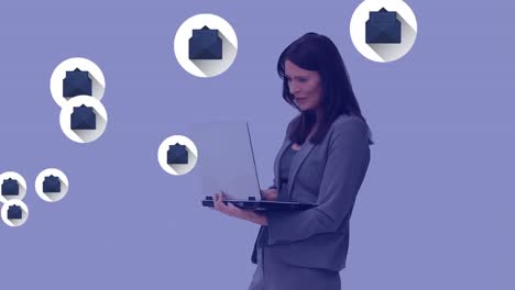 Multiple-envelope-icons-floating-against-woman-using-laptop