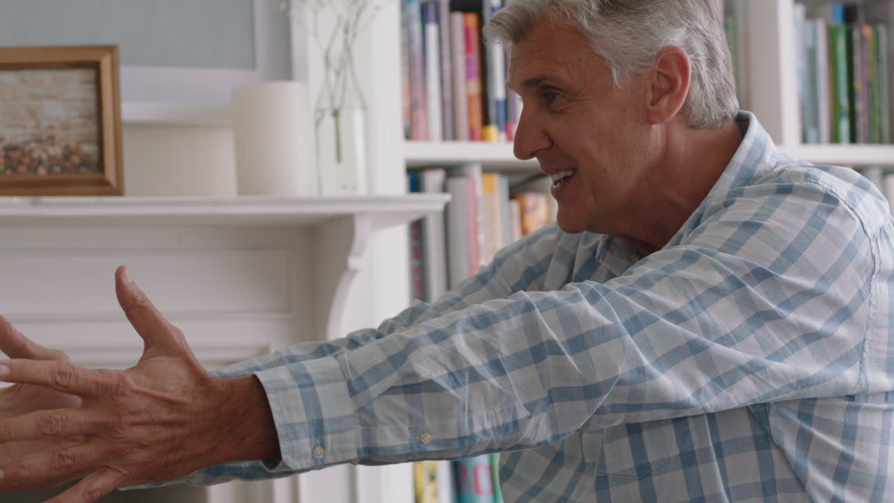 cute little girl hugging grandfather playfully jumping into grandad's arms having fun enjoying weekend with grandparent at home