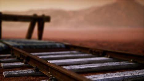 abandoned railway tracks in the desert