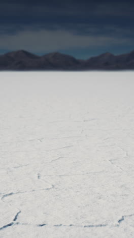 salt flats with mountains in the distance