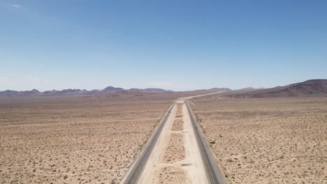 cars and trucks driving on highway in desert