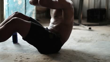 boxer performing crunches in the gym