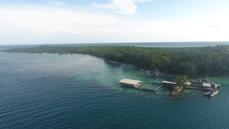 Drone-camera-moving-Backward-or-dolly-out-over-beautiful-beach-of-Karimun-Jawa-island