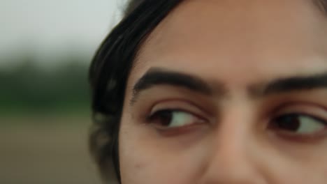 close-up of a person's eyes with a soft-focus background, evoking introspection or thoughtfulness