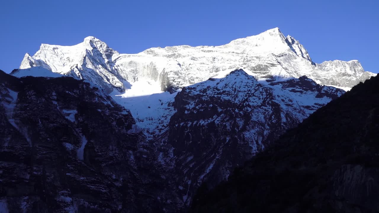 A captivating timelapse of Himalayan peaks with clouds sweeping across rugged high-altitude slopes, revealing the dramatic beauty and changing light of the mountain landscape