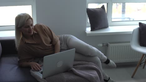 woman using laptop computer on a outdoor terrace, blank green screen mockup copy space