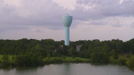 drone view of light blue water tower overlooking brays bayou in houston, tx