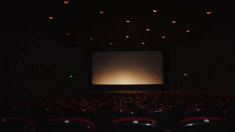 step into the heart of cinematic luxury with this wide-angle view of a modern movie theater interior