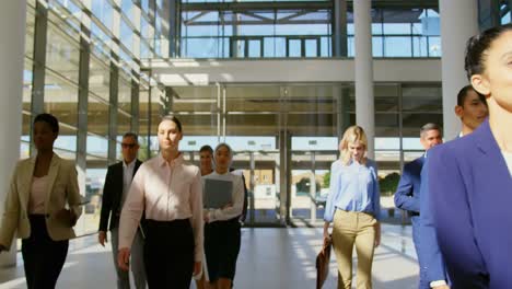 multi ethnic business people walking together in the lobby at office 4k