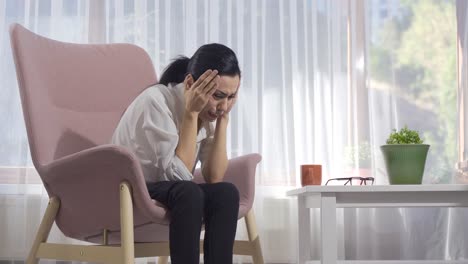 sad woman sitting alone and crying.