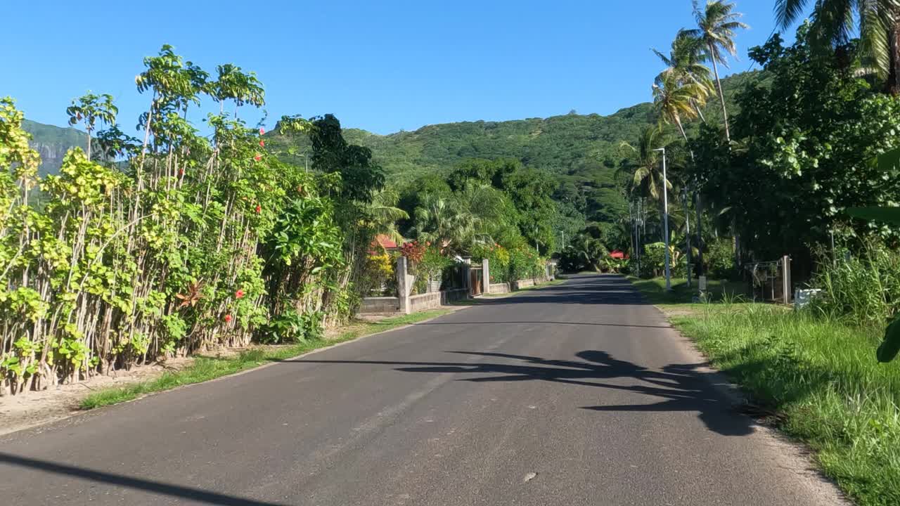 Riding on Motorbike on Coastal Road on Bora Bora Island, French Polynesia, Rider Point of View