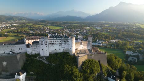 aerial pullback reveals salzburg castle