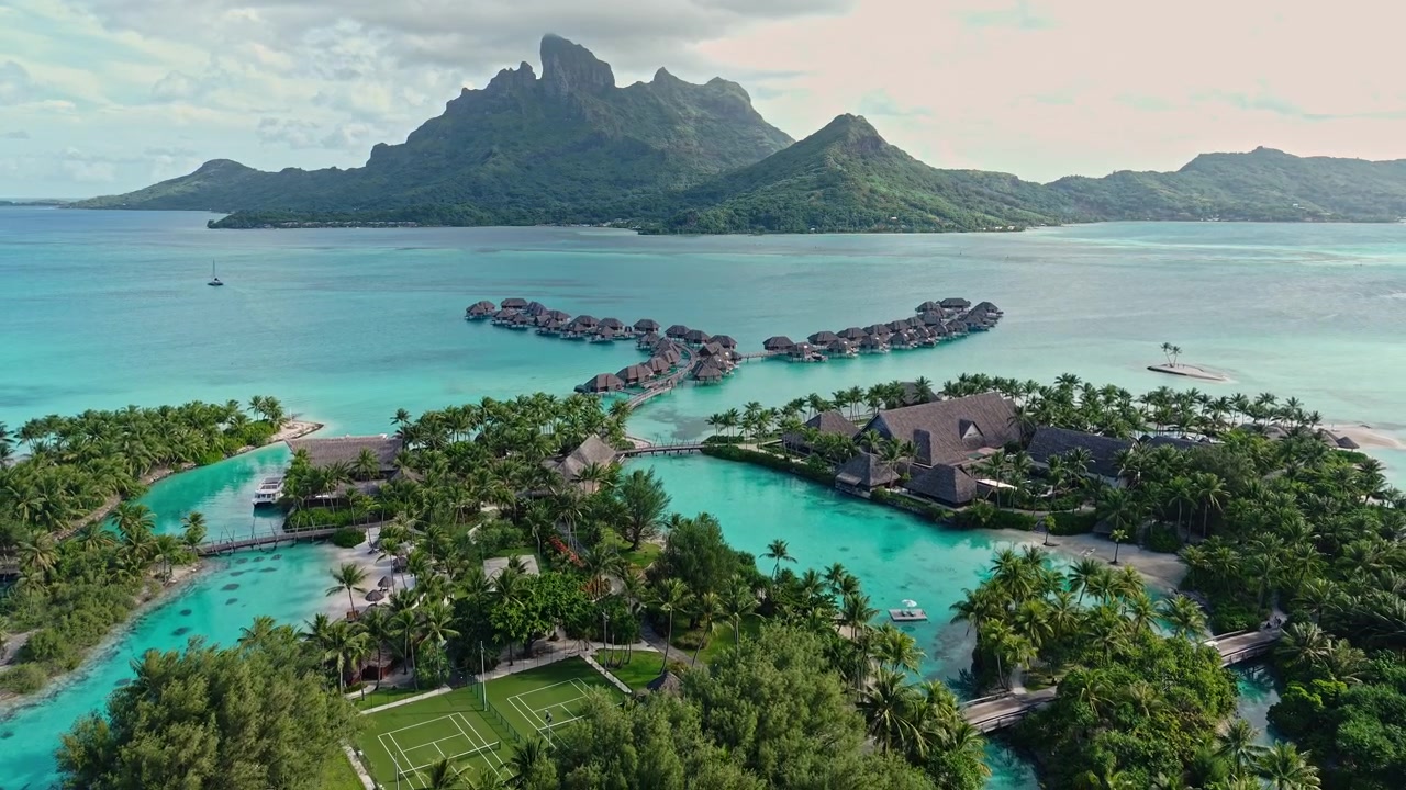 Drone Shot of Bora Bora Island Luxury Resort With Lagoons and Bungalows Over Turquoise Water, French Polynesia