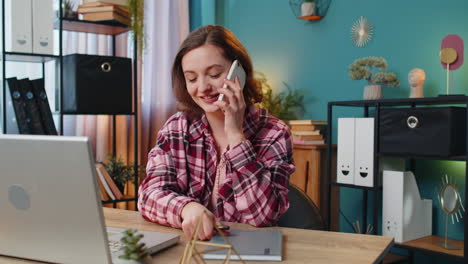 business woman freelancer answering to client on mobile phone call using smartphone conversation