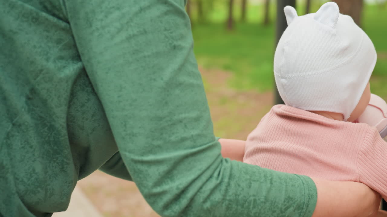 Mother Delicately Feeding Infant In Peaceful Park, Gentle Mother Provides Soothing Nourishment On Quiet Park Bench, Peaceful Scene Of Mother Tenderly Nourishing Her Baby In Serene Park Surroundings