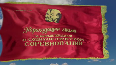 Slow-motion-shot-of-a-communist-banner-flying-against-a-vivid-blue-sky