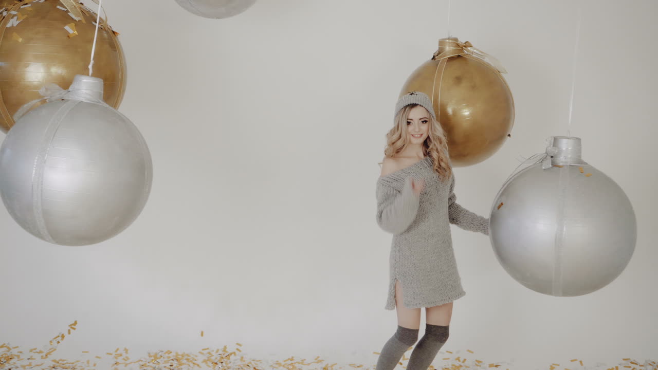 Celebrating new year. Celebration party with confetti falling everywhere on woman