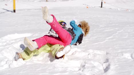 young couple enjoying a frolic in the snow