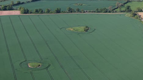 ireland's mystical fairy forts, ancient ringforts, surrounded by modern farmland