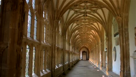 the quiet, atmospheric, arched cloisters in the beautiful medieval cathedral of wells, in england's smallest city