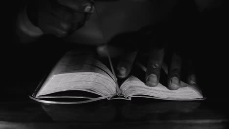 praying-to-god-with-bible-on-table-with-people-stock-video-stock-footage