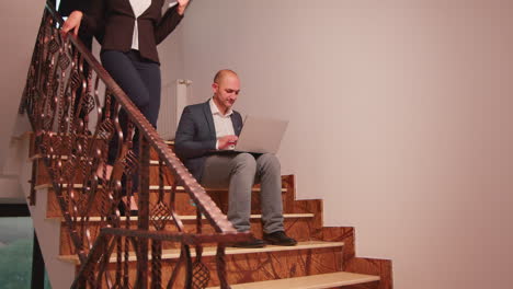 overworked business man smoking sitting on stairs