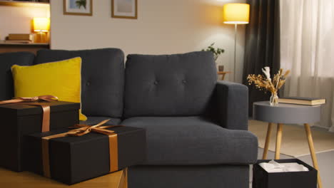 Close-Up-Of-Gift-Wrapped-Presents-On-Table-In-Lounge-At-Home