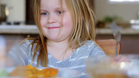 girl shaking her head while having food 4k