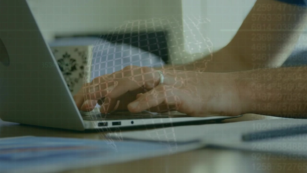 Person Typing on Laptop with Digital Global Data Overlay