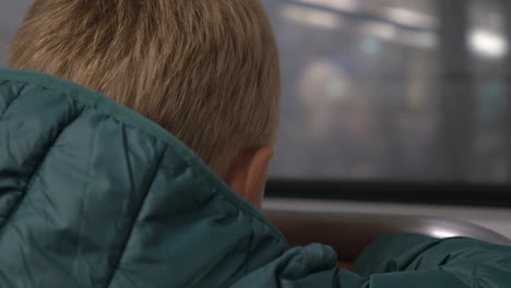 Little-boy-in-moving-subway-train