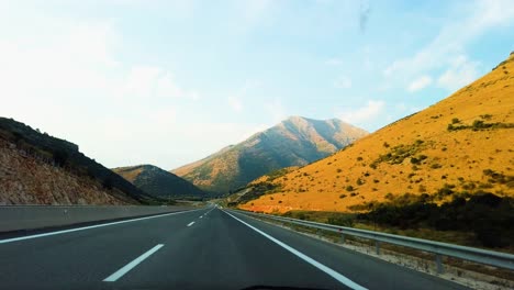 Car-driving-on-autobahn-in-Greece-in-the-afternoon-straight,-first-person-view