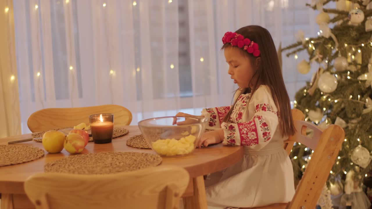 Mother and Daughter Preparing for Christmas Celebration
