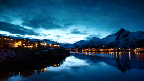 absolutely stunning glassy dusk shot of svolvær, lofoten, norway