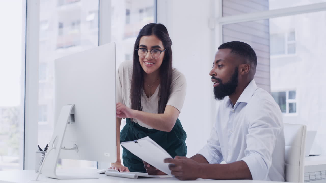 two businesspeople working together in an office