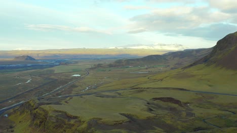aerial high view iceland natural landscape, green mountains horizon, ascending shot