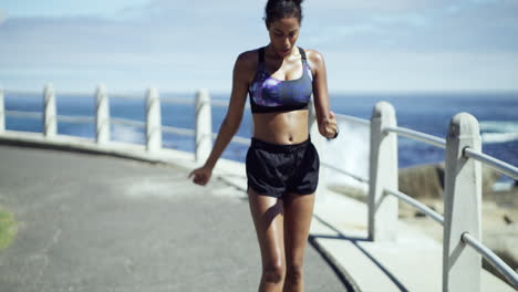 woman running outdoors near the ocean