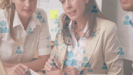 Collaborating business professionals using digital network animation in office setting