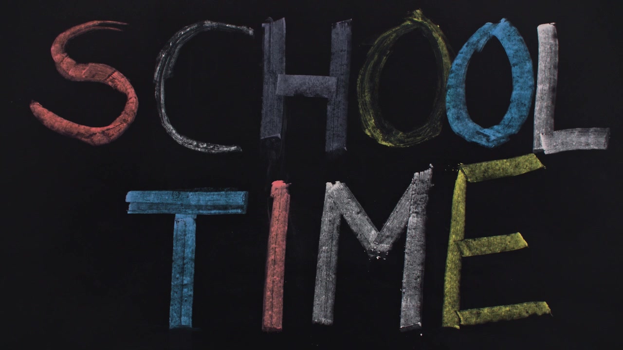 Text 'school time' on the blackboard