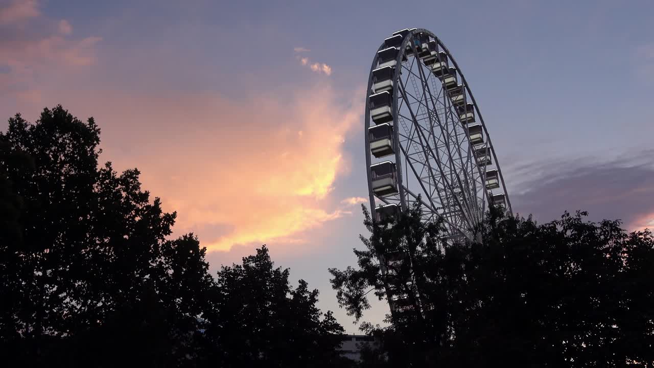 4K. The Budapest Eye ferris wheel is turning. It is getting dark