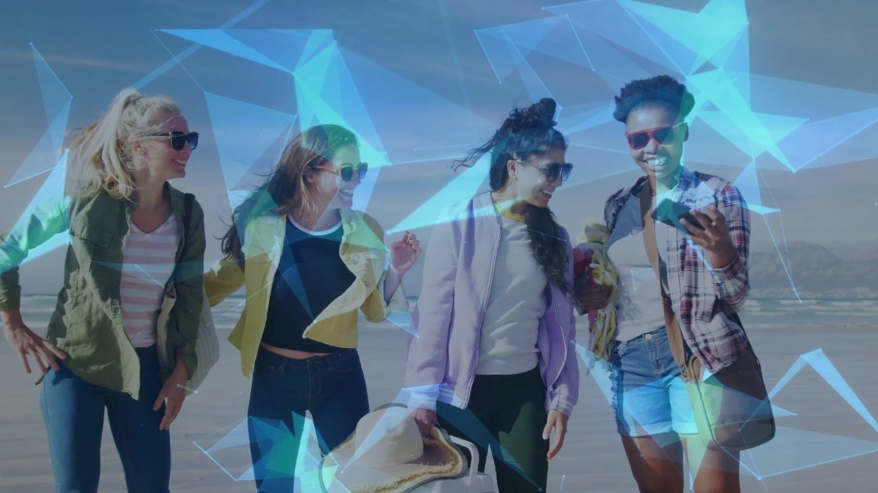 Four women posing on beach, right woman taking selfie for travel, blue shards drifting across group