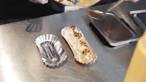 delicious steamed siomai in a paper plate with chili garlic and soy sauce
