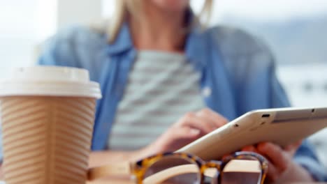 businesswoman using digital tablet at her desk