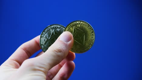 business investor hand holding crypto silver and gold coins cryptocurrency digital currency ethereum investment concept
