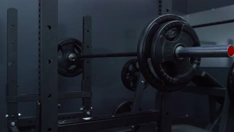 bench press with barbell on top inside a gym sport club