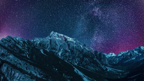 surreal and outlandish view of the night sky above the sella mountain in south tyrol, italy