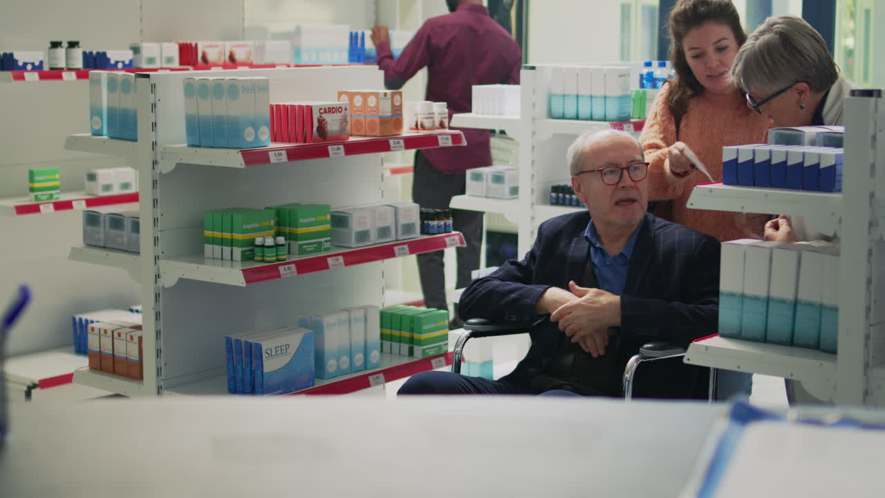 Elderly Customer at Pharmacy Assisted by Pharmacist