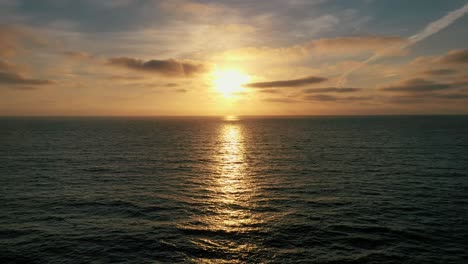 Sunset-Beach-Sky-And-Sea-Horizon---aerial-pullback